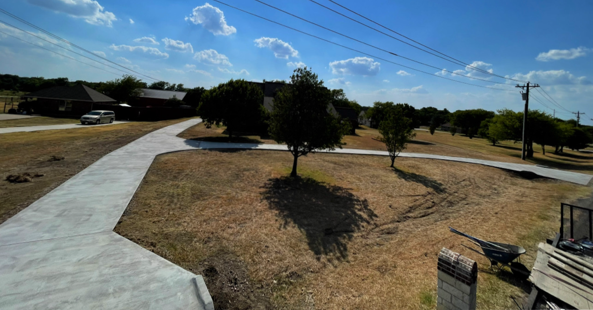 Aerial view of wide curved concrete driveway