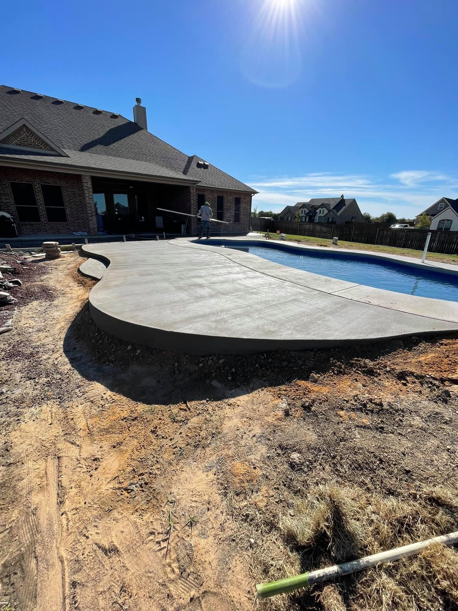Curved concrete pool deck installation in progress